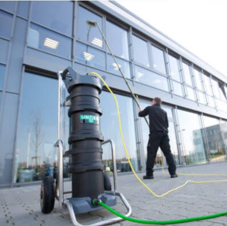 Cleaner using a water-fed pole system to clean commercial building windows
