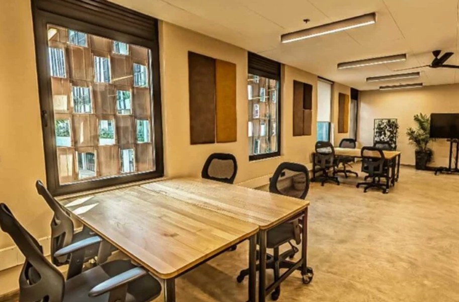 Bright, clean shared office space with wooden desks