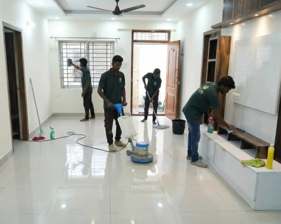 Cleaning crew deep-cleaning the floors of a home